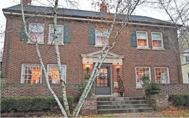  ?? MILWAUKEE JOURNAL SENTINEL ANGELA PETERSON, ?? The three-story 1926 brick Colonial Revival home has four bedrooms and 21⁄2 bathrooms. Decorated for the holidays, the home will be featured in the Hartford Historical Society Home Tour Dec. 9.