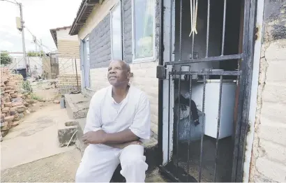  ?? Picture: Nigel Sibanda ?? Patrick Mathumzi, who is visually impaired, after receiving the title deed for a Soweto house from the housing department.