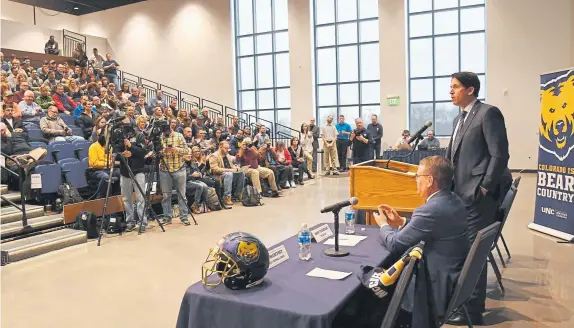  ?? Hyoung Chang, The Denver Post ?? The University of Northern Colorado introduces former Broncos wide receiver Ed Mccaffrey, right, as its new football coach Friday.