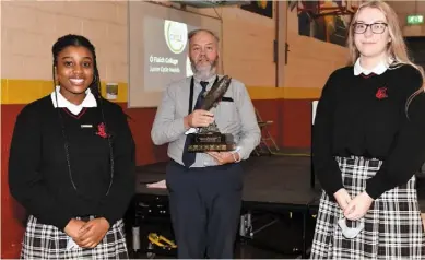  ??  ?? Top photo, Mr. Rafferty addresses the socially distanced attendance at the Ó Fiaich College Junior Cycle Awards Ceremony