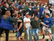  ?? DAVID TURBEN — THE NEWS-HERALD ?? The Madison crowd goes wild after Griffin Albert’s steal and layup during the Blue Streaks’ win over Perry Feb. 23.