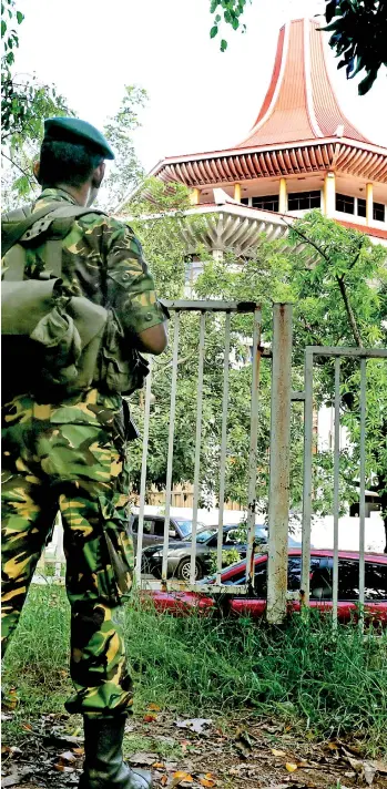  ??  ?? With the Supreme Court and the Court of Appeal taking up cases that could change the course for Sri Lanka’s history, tight security has been imposed around the Court Complex.Pic by Lahiru Harshana