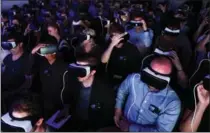  ?? CHRIS RATCLIFFE, BLOOMBERG ?? Samsung Gear VR virtual reality headsets in use during a Samsung Electronic­s event in London on Aug. 2.
