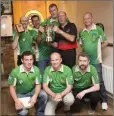  ??  ?? Woodpecker ‘C’, winners of the Div 2 Cup, with profession­al John Lowe: Willy Walsh, Deano Doran, Daryl Murphy, Jason Canavan. Front: Enda Gethings, John Ennis, Lillian Downes.