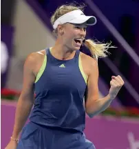  ?? AFP ?? Caroline Wozniacki celebrates after beating former No. 1 Angelique Kerber 7-6 (4), 1-6, 6-3 in the Qatar Open quarterfin­als. —