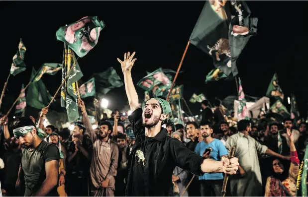  ?? SAD ZAIDI / BLOOMBERG ?? Supporters cheer during a campaign rally for Pakistan Muslim League-Nawaz in Rawalpindi n Monday. Whoever wins Pakistan’s election this week, gains in the rupee, stocks and bonds are likely to be short-lived as the new government grapples with a...