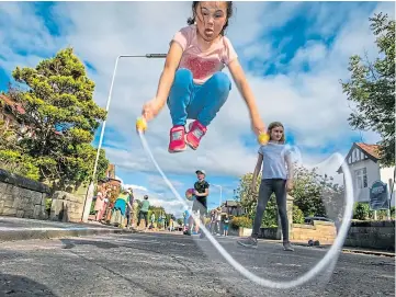  ??  ?? JUMP UP : Play Streets close streets for children to play. Picture by Steve Brown.