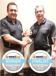  ??  ?? Michael Slaughter of Smartline Drouin (left) is congratula­ted by Smartline State Manager Victoria/Tasmania Brad Sutton.