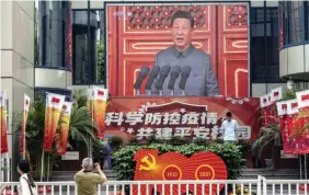  ?? BLOOMBERG ?? A screen shows a live news broadcast of Chinese President Xi Jinping speaking at a ceremony marking the centenary of the Chinese Community Party at Beijing’s Tiananmen Square on July 1