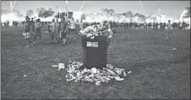  ?? CAMILLE FINE/CHICAGO TRIBUNE ?? An overfilled recycling bin is seen at Riot Fest as the evening winds down in Chicago’s Douglas Park on Sept. 14.