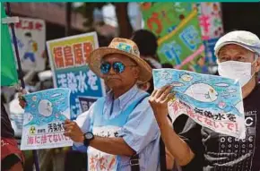  ?? AFP PIC ?? Protesters taking part in a rally against the Japanese government’s plan to release treated wastewater from the crippled Fukushima Daiichi power plant into the ocean in Tokyo last year.
