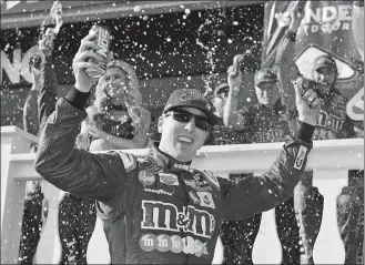  ?? DERIK HAMILTON/AP PHOTO ?? Kyle Busch celebrates in Victory Lane after winning the NASCAR Cup race Sunday at Long Pond, Pa.