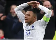  ?? AFP ?? Kylian Mbappe celebrates after scoring France’s fourth goal in the Euro 2024 qualifier against the Netherland­s in Paris