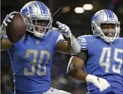  ?? LON HORWEDEL — THE ASSOCIATED PRESS ?? Detroit Lions running back Jamaal Williams, left, celebrates his touchdown run with teammate Jason Cabinda in Detroit’s season-opening loss to the San Francisco 49ers Sept. 12. Williams, who played for the Green Bay Packers from 2017-2020, faces his former team today.