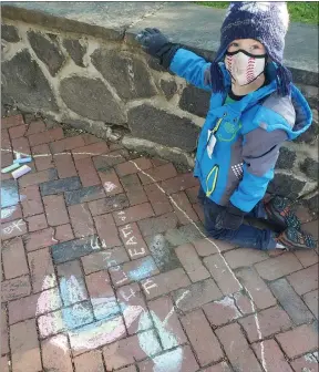 ?? SUBMITTED PHOTO ?? A Friends School student creates chalk art to recognize Earth Day.