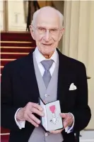  ?? Photograph: John Stillwell/ PA ?? William Frankland with his MBE for services to allergy research, which he was awarded in 2015.