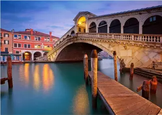  ?? ?? The Rialto Bridge is one of Venice's iconic landmarks Canva