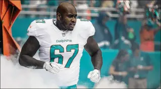 ?? ALLEN EYESTONE / THE PALM BEACH POST ?? Laremy Tunsil, the Dolphins’ top draft pick in 2016, is a key to the offensive line’s developmen­t. As a firstyear starter at left tackle, Tunsil was plagued by penalties and sacks.