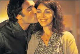  ?? Menemsha Films ?? ILAN HALIMI (Syrus Shahidi) kisses his mother (Zabou Breitman) in “24 Days.” The film shows his fate, bad instincts by the police, and his family’s wait.