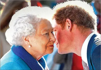  ?? ?? ‘TOP MARKS’: The Queen with the Duchess of Sussex in Chester in 2018, left. Above: With Prince Harry in 2015