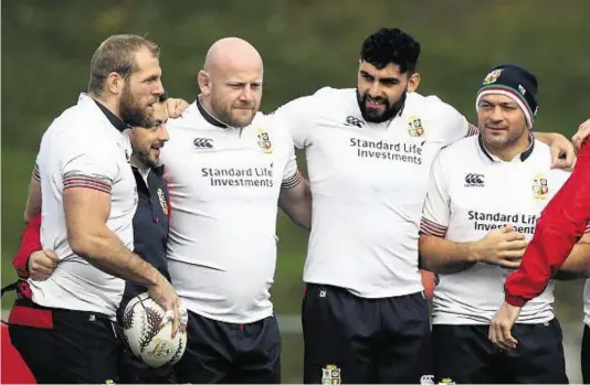  ??  ?? TIGHT KNIT GROUP: Members of the British and Irish Lions squad gather around captain Rory Best during a training session at Porirua Park in Wellington ahead of the match against the Hurricanes