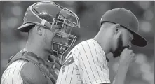  ?? AP/NAM Y. HUH ?? Chicago Cubs catcher Willson Contreras talks with relief pitcher Carl Edwards Jr. during the eighth inning of Saturday’s game against the Chicago White Sox. Edwards had a rare bad day, prompting a Twitter user to suggest he be demoted to Class AAA Iowa.