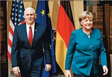  ?? JOHANNES SIMON/GETTY ?? Vice President Mike Pence met with German Chancellor Angela Merkel on Saturday.