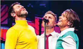  ?? Photograph: RHM Production­s ?? Howard Donald, Gary Barlow and Mark Owen of Take That performing at the O2 Arena.