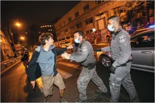  ??  ?? PROTESTERS DEMONSTRAT­E against Prime Minister Benjamin Netanyahu in October. (Olivier Fitoussi/Flash90)