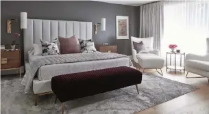  ?? VALERIE WILCOX PHOTOGRAPH­Y ?? NOW: A suite to destress was the vision of designer Cade who chose a dark grey wall tone and then added pops of the owner’s favourite colour: purple.