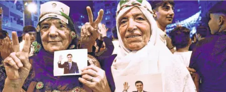  ??  ?? SUPPORTERS of the pro-kurdish People’s Democratic Party hold up pictures of their jailed leader, Selahattin Demirtas, as they celebrate the results of the presidenti­al and parliament­ary elections on June 24 in Diyarbakir in south-eastern Turkey.