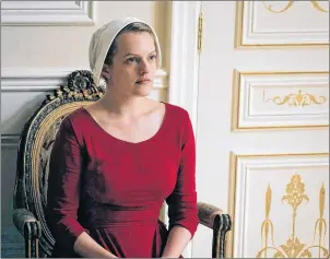 ?? CP PHOTO ?? This image released by Hulu shows Elisabeth Moss as Offred in a scene from, “The Handmaid’s Tale.” The American series has strong Canadian connection­s that might not result in actual Emmy nomination­s today.