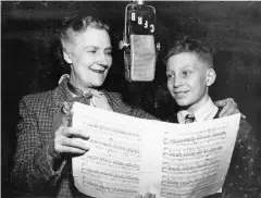  ??  ?? Top Left: The cover of Kate Aitken’s Canadian Cook Book. Top Right: Kate Aitken with a chicken. Bottom: Kate Aitken speaks with a boy during a radio broadcast.