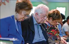  ?? CURTIS COMPTON/ AJC 2019 ?? President Jimmy Carter, seen in 2019 at Maranatha Baptist Church in Plains with wife Rosalynn ( left), says they “are in full support of COVID- 19 vaccine efforts and encourage everyone who is eligible to get immunized as soon as it becomes available.”