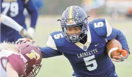  ?? JONATHON GRUENKE/DAILY PRESS ?? Lafayette's Dea'Mario Tyler, right, carries the ball toward Poquoson's Jake Williams during Saturday's game at Wanner Stadium in James City.