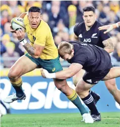  ?? — AFP photo ?? Wallabies fullback Israel Folau(L) is facing the sack by Australia's rugby union over homophobic comments.