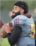  ??  ?? ASU QB Manny Wilkins (5) throws a pass during a spring practice.