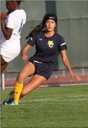  ??  ?? Mendocino College Eagles freshman Brisa Villa (8), sends a ball to a teammate who scored the Eagles’ first goal on the play in the match vs. Merritt College, won by the Eagles.