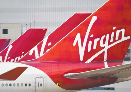  ?? Picture: OLI SCARFF/AFP ?? LOOKING AHEAD: Both Virgin bidders have previously flagged operating a smaller, single-branded domestic and short-haul internatio­nal airline that also has growth potential.