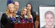  ?? THE ASSOCIATED PRESS ?? Centre County District Attorney Stacy Parks Miller, left, announces findings of an investigat­ion into the death of Penn State University fraternity pledge Tim Piazza, seen in photo at right, as his parents, Jim and Evelyn Piazza, second and third from...