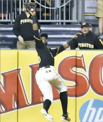  ?? Matt Freed/Post-Gazette ?? Left fielder Gregory Polanco goes back to take a hit away from Cincinnati’s Tucker Barnhart Tuesday night at PNC Park.