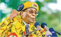  ?? AFP-Yonhap ?? Zimbabwe’s then President Robert Mugabe addresses party members and supporters gathered at his party headquarte­rs in this Nov. 8, 2017 file photo.