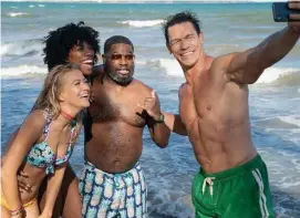  ??  ?? SELFIE SHOT: John Cena, right, stars in ‘Vacation Friends’ with, from left, Meredith Hagner, Yvonne Orji and Lil Rel Howery.