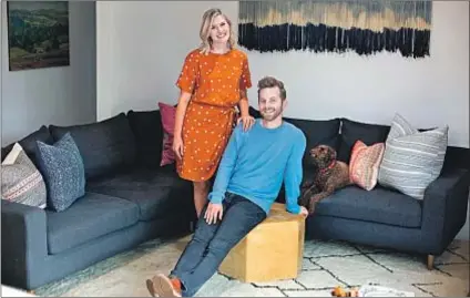  ?? Photograph­s by Jesse Goddard For The Times ?? TRY GUYS comic Ned Fulmer and his wife, Ariel, in the living space of their Elysian Valley home.