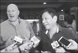  ??  ?? Incoming president Rodrigo Duterte presents Peter de Cauwer to media as his personal chef in Davao City yesterday.