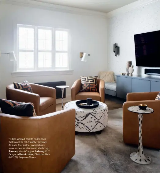  ??  ?? “Gillian worked hard to find fabrics that would be cat-friendly,” says Aly. As such, four leather swivel chairs serve as den furniture atop a hide rug. Sconces, Visual Comfort; hide rug, EHT Design; millwork colour, Charcoal Slate (HC-178), Benjamin Moore.