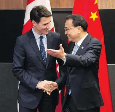  ?? ADRIAN WYLD/THE CANADIAN PRESS ?? Prime Minister Justin Trudeau meets with Chinese Premier Li Keqiang on Wednesday before the Canada-China annual leaders dialogue in Singapore, where he is seeking to double Canadian agricultur­al exports to China.
