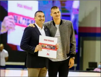  ?? PHOTO COURTESY OF MEGA BASKETBALL ?? Nikola Jokic with his former coach, Dejan Milojevic, during the summer of 2020.