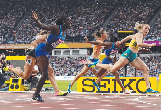  ?? Picture: AP ?? Gold Coast’s Sally Pearson crosses the line ahead of her competitio­n to win gold in the women's 100-metre hurdles final at the World Athletics Championsh­ips.