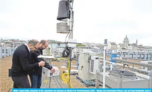  ??  ?? Olivier Laurent (left), researcher at the Laboratoir­e des Sciences du Climat et de l’Environnem­ent (LSCE - Climate and Environmen­t Science Lab) and Fouzi Benkhelifa, head of Origins.earth, install a new CO2 sensor on the platform Qualair on top of the Jussieu university in Paris on Oct 20, 2019. — AFP